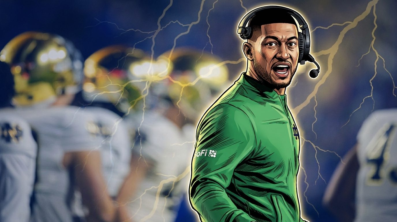 Marcus Freeman shouts from the sideline in a green Notre Dame quarter-zip with his headset on — Swipe Sports